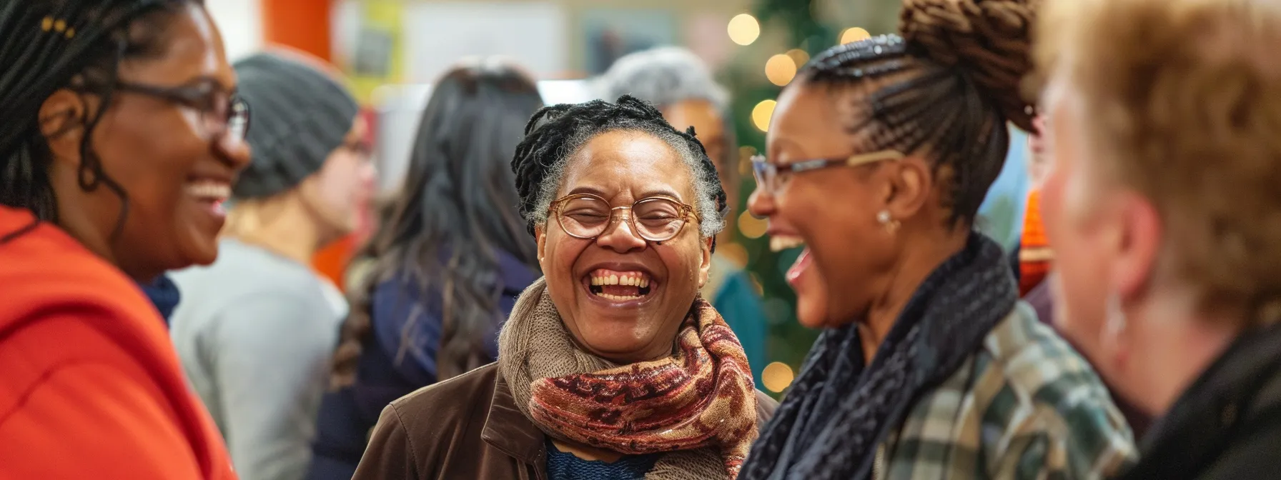 a diverse group of individuals laughing and chatting together at a vibrant community center event, fostering a sense of inclusion and connection.