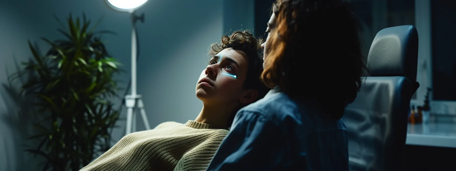 a therapist guiding a patient through eye movement desensitization and reprocessing (emdr) therapy, with focused intensity and gentle reassurance.