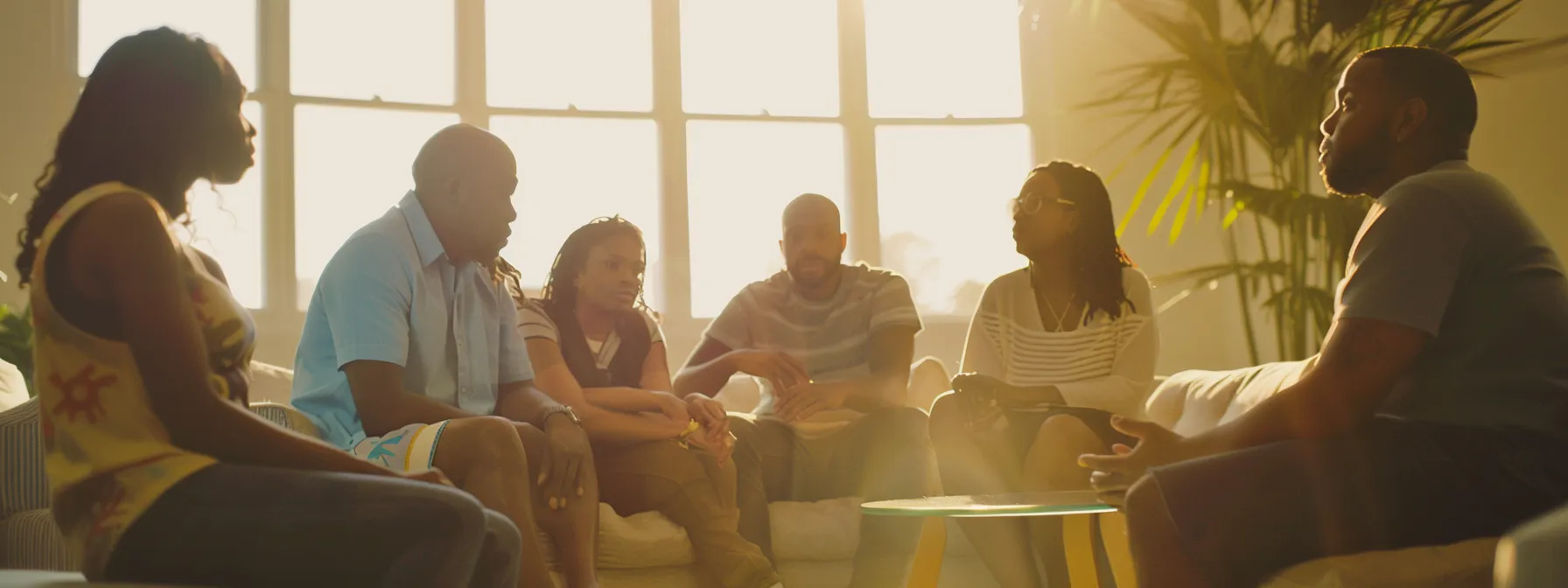a group therapy session in an intensive outpatient program, with diverse individuals engaged in deep conversation and receiving support from a therapist.