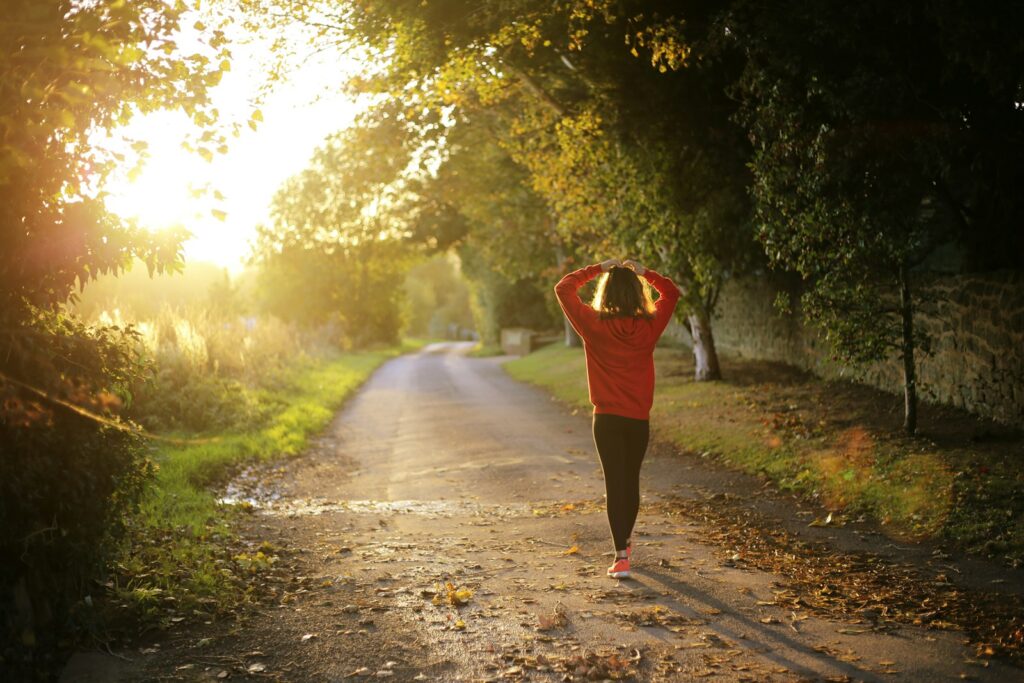 Health and Mental Well-Being. woman walking on pathway during daytime