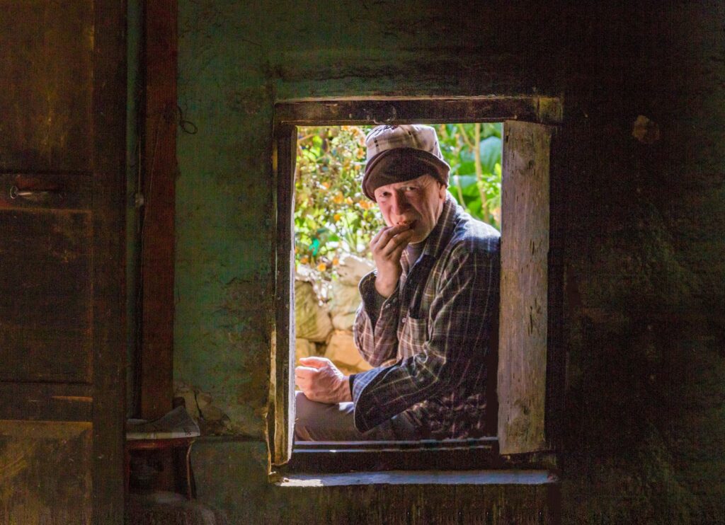 may13-elderly-man-window-rokka