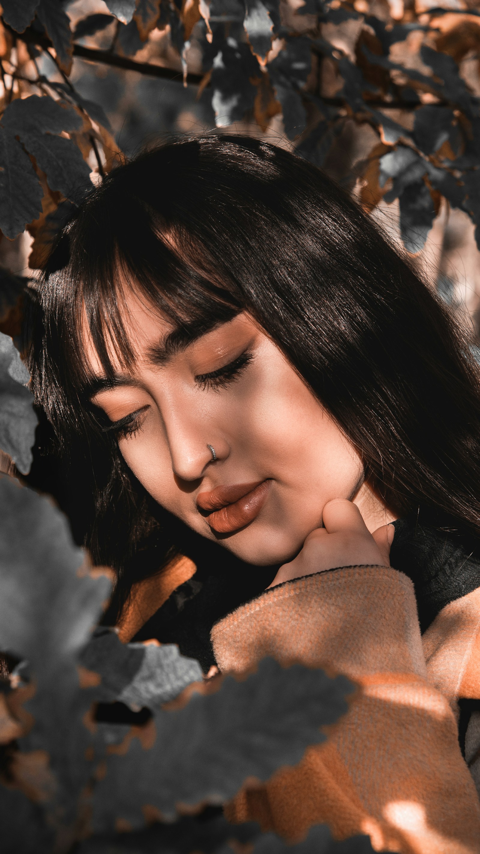 EMDR Therapy Explained: The 8 Phases + What to Expect 2 A woman with eyes closed in soft natural light, a contemplative scene
