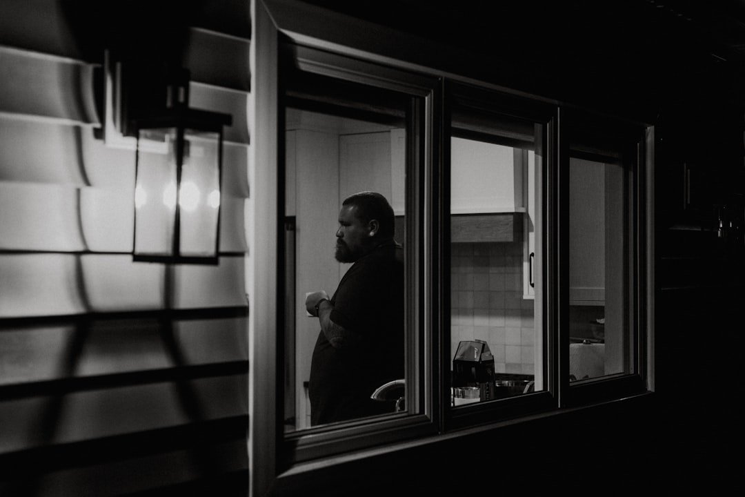 A man looking out of a train window.