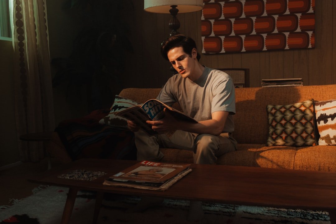 What to Expect at a Virtual IOP in Arizona 6 man in white crew neck t-shirt sitting on brown sofa.