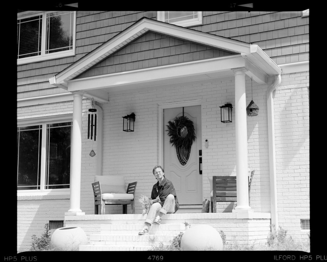Virtual IOP in Chandler, Arizona 6 Person sitting on front porch steps of a house.