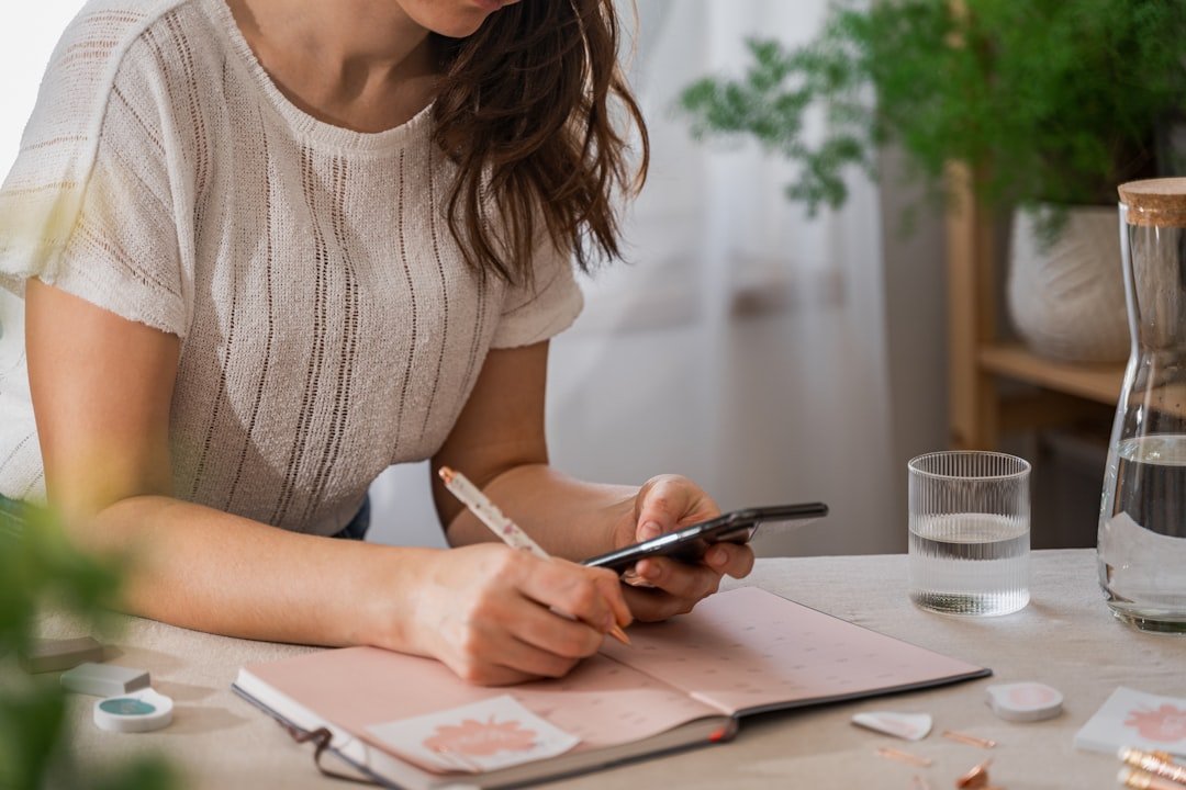 girl planing a week at home office in bright room.