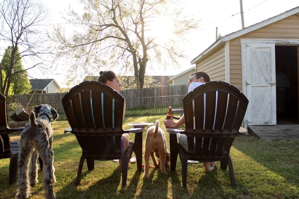 man and woman sitting on chairs.