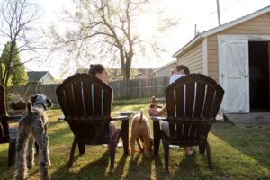 man and woman sitting on chairs.