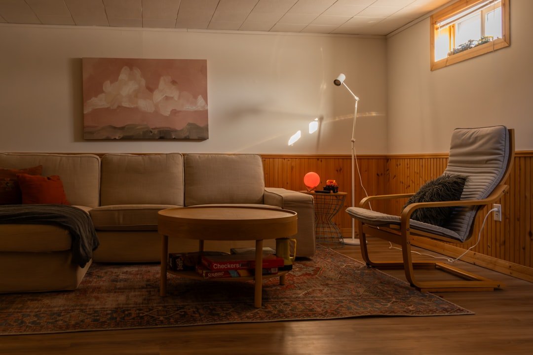 Cozy living room with sectional couch and armchair.