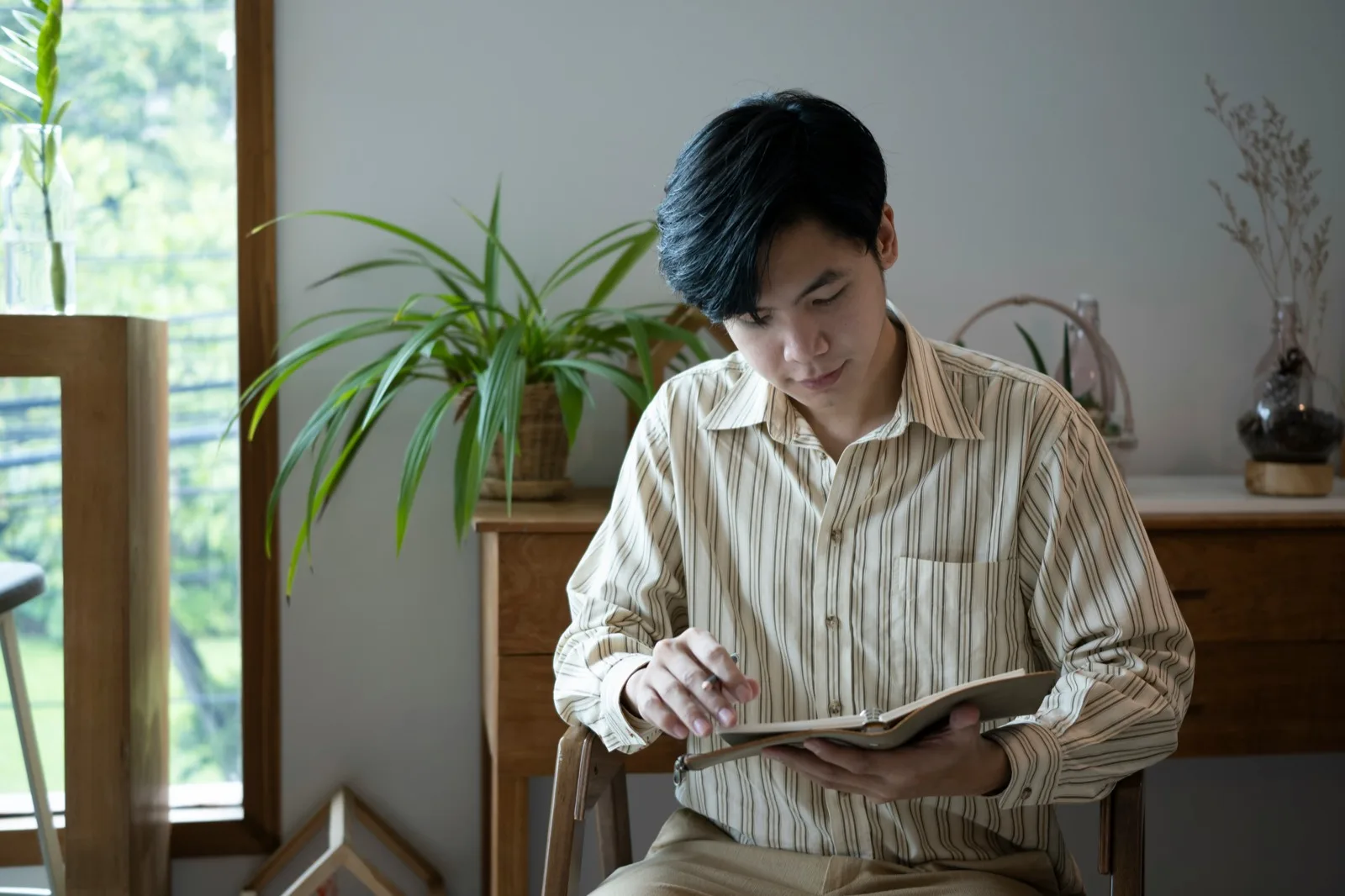 Adult reading in his living room