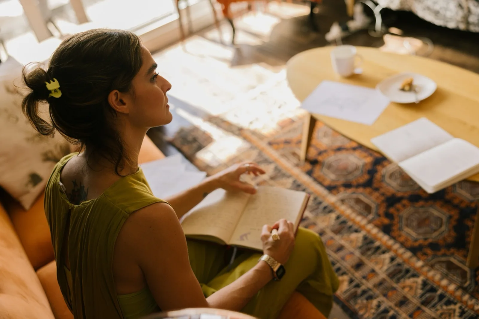 Young adult with an open notebook, practicing between sessions