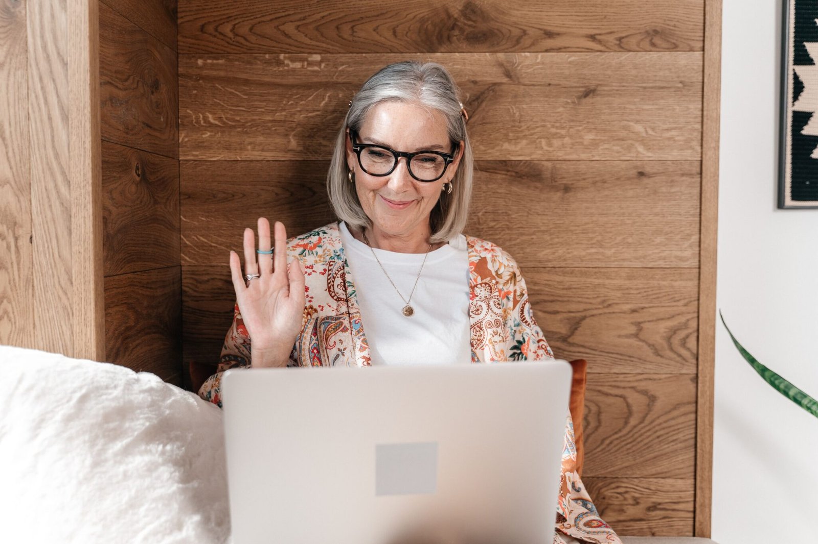 Adult joining a virtual IOP session from home on a laptop, covered by UnitedHealthcare